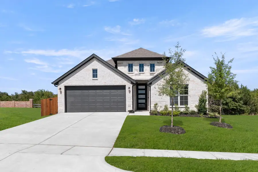 Front exterior of a new home in Waterford Park, Weatherford, TX, highlighting curb appeal (Image 1). Front exterior of a new home in Waterford Park, Weatherford, TX, highlighting curb appeal (Image 1).