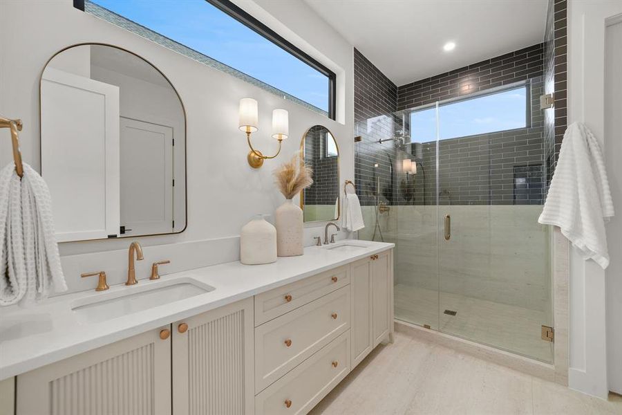 Full bathroom with double vanity and a shower stall Full bathroom with double vanity and a shower stall
