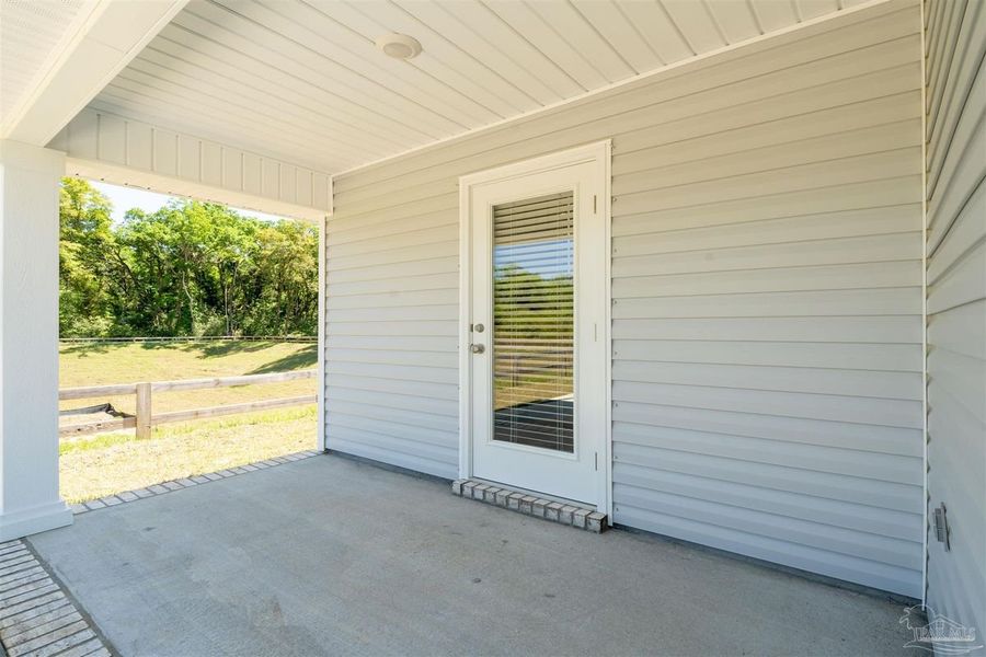 Exterior details and patio area of a home in Turtle Creek, Cantonment (Image 2).