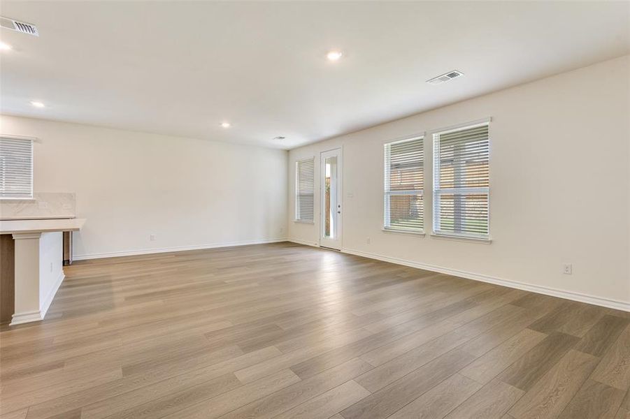 Unfurnished living room featuring recessed lighting and light wood-type flooring Unfurnished living room featuring recessed lighting and light wood-type flooring