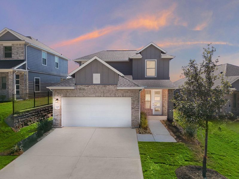 Front exterior of a new home in Westridge Cove, Conroe, TX, highlighting curb appeal (Image 2).