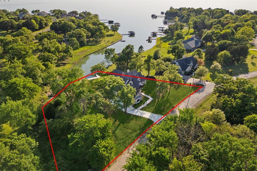 Aerial overview of property's location with a large body of water and property parcel outlined Aerial overview of property's location with a large body of water and property parcel outlined