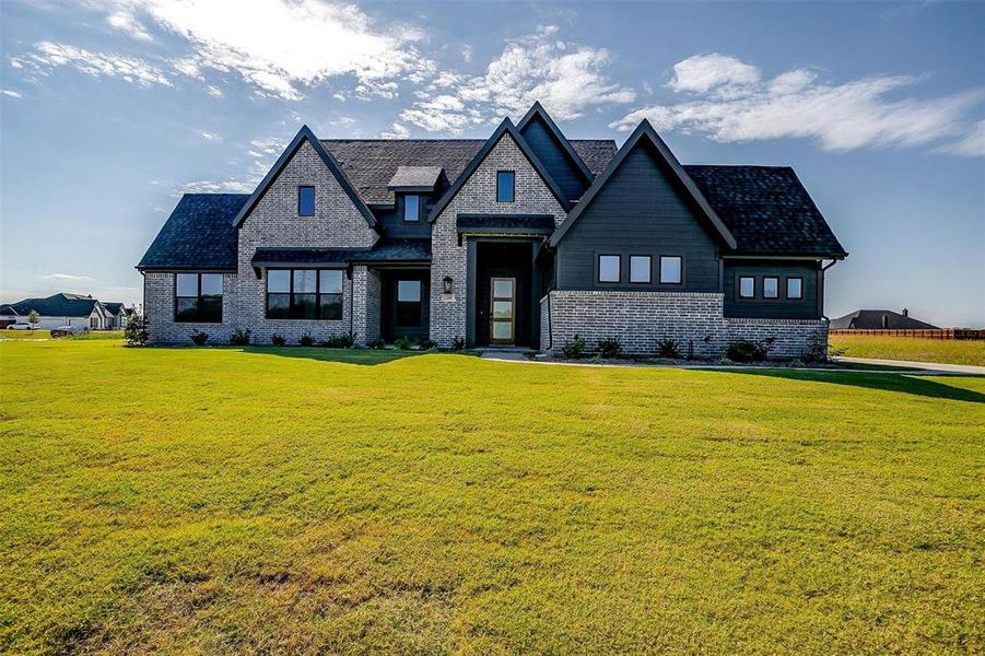 View of front of home with a front lawn