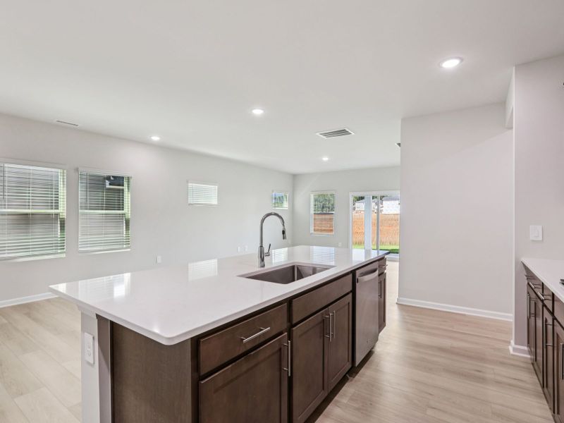 Kitchen in the Paisley floorplan at a Meritage Homes community in Garner, NC.