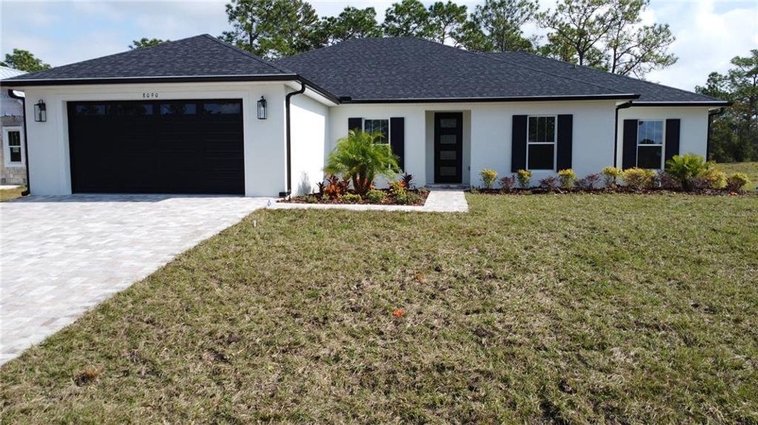 Front exterior of a new home in , Brooksville, FL, highlighting curb appeal (Image 1).