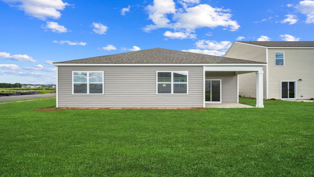 Exterior details and patio area of a home in The Groves at Bees Creek, Ridgeland (Image 23). Exterior details and patio area of a home in The Groves at Bees Creek, Ridgeland (Image 23).