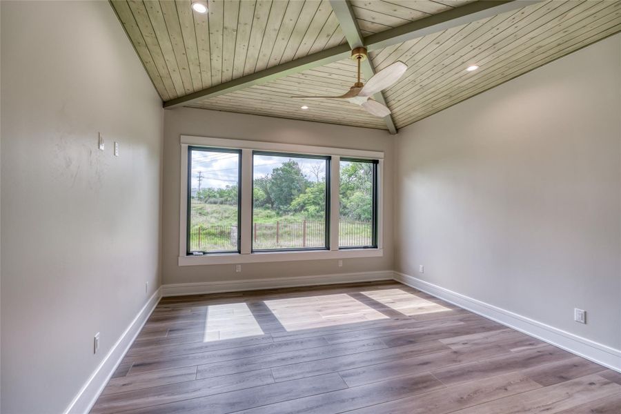 Empty room featuring wooden ceiling, wood finished floors, baseboards, a ceiling fan, and recessed lighting