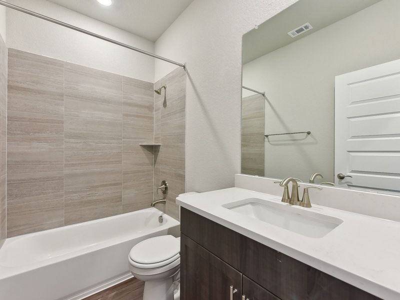 Furnished interior view inside a new home in Big Sky Ranch - Executive Collection, Dripping Springs (Image 5).