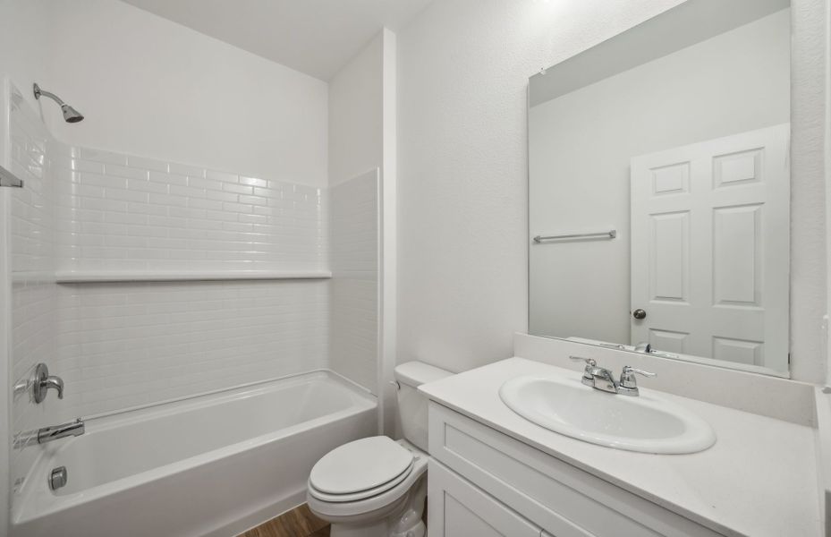 Spacious secondary bathroom with dual vanity *real home pictured