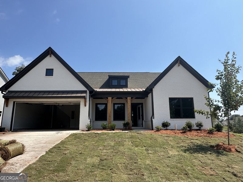 Front exterior of a new home in Rosewood Lake Preserve, Hoschton, GA, highlighting curb appeal (Image 2). Front exterior of a new home in Rosewood Lake Preserve, Hoschton, GA, highlighting curb appeal (Image 2).