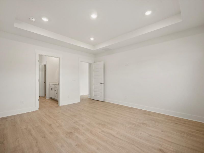 Spacious, unfurnished interior of a new home in The Coves at Lakes of Cane Bay, Summerville (Image 20).