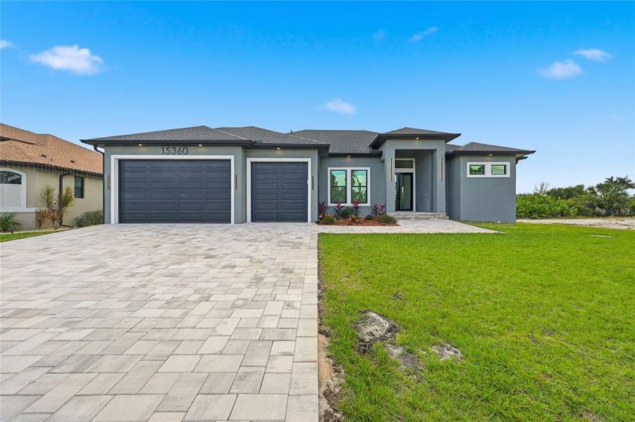 Front exterior of a new home in , Port Charlotte, FL, highlighting curb appeal (Image 26). Front exterior of a new home in , Port Charlotte, FL, highlighting curb appeal (Image 26).