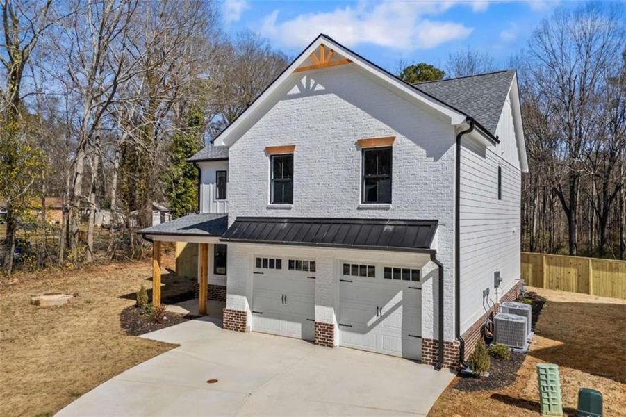 Front exterior of a new home in , Monroe, GA, highlighting curb appeal (Image 22).