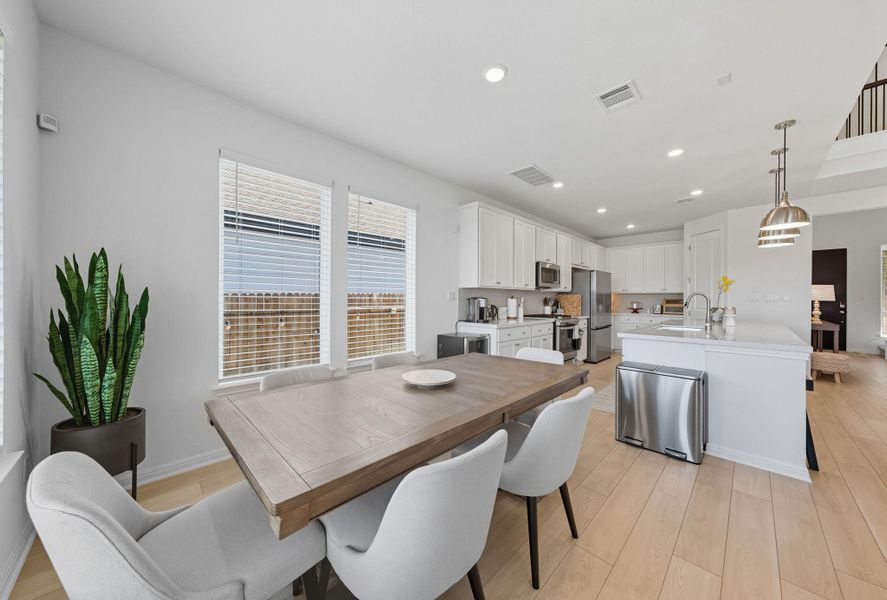 Dining space featuring light wood-type flooring and recessed lighting Dining space featuring light wood-type flooring and recessed lighting