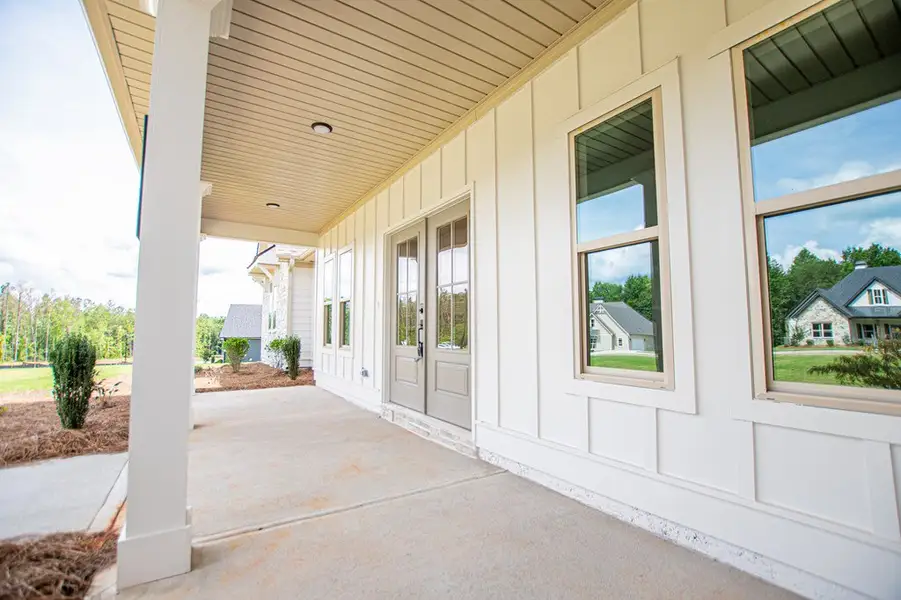 Exterior details and patio area of a home in WOODMONT RESERVE, Roopville (Image 40).