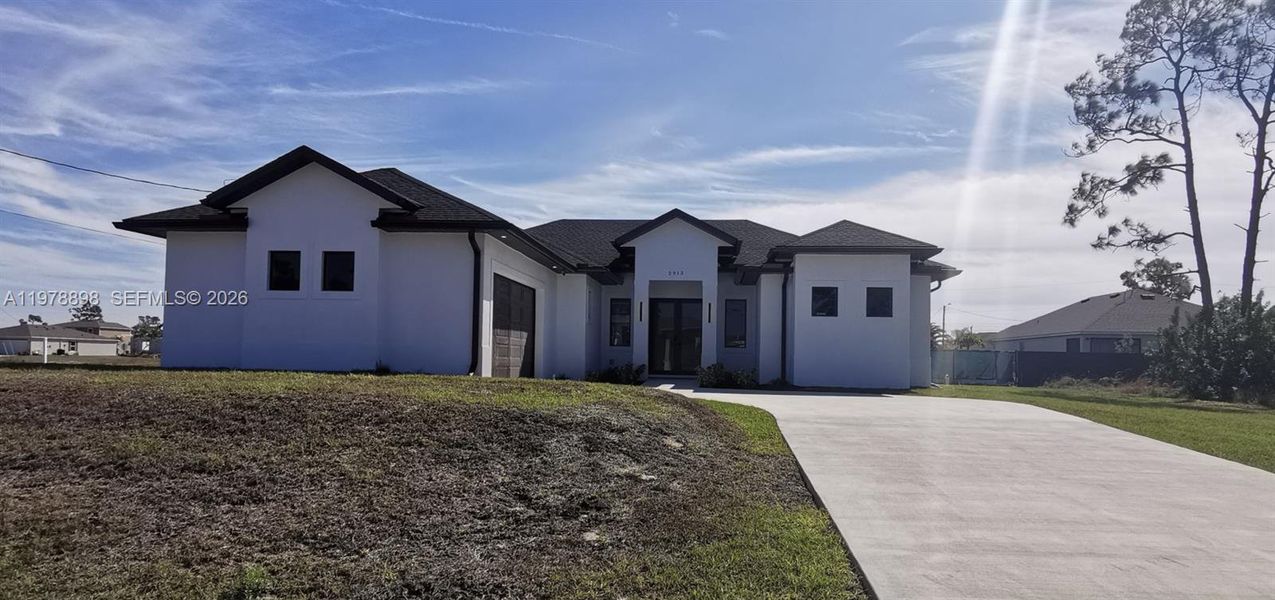 Front exterior of a new home in , Cape Coral, FL, highlighting curb appeal (Image 25).