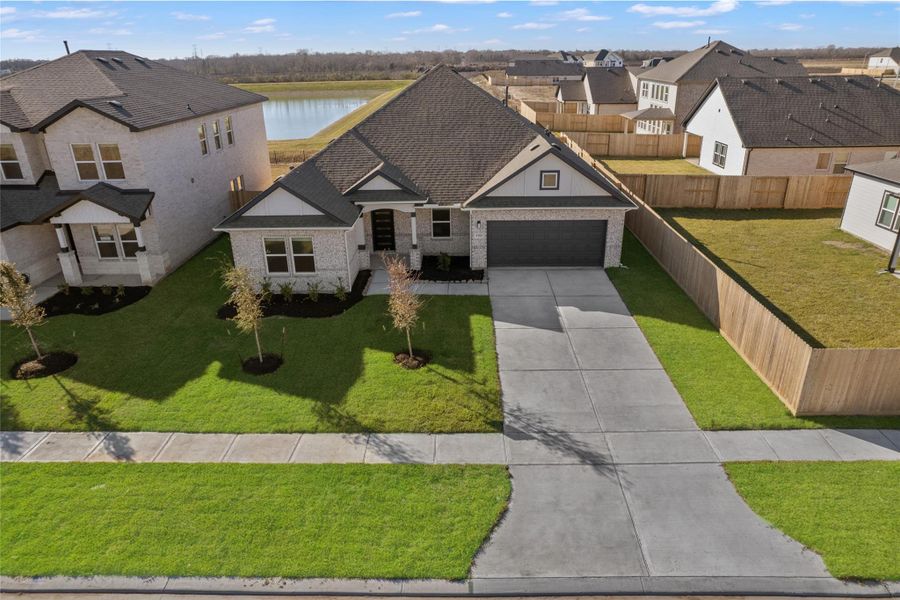 Front exterior of a new home in Ashland, Angleton, TX, highlighting curb appeal (Image 17).