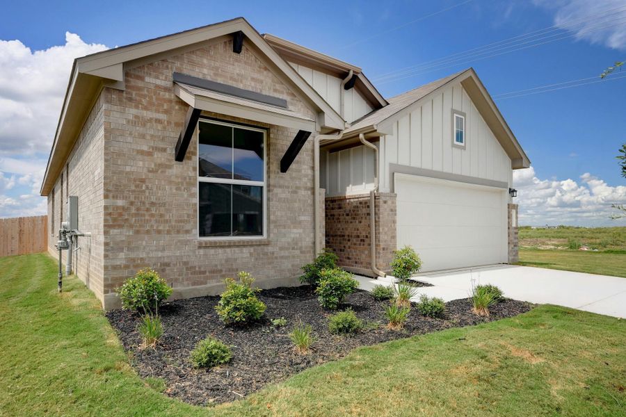 Front exterior of a new home in Willowbrook, New Braunfels, TX, highlighting curb appeal (Image 2). Front exterior of a new home in Willowbrook, New Braunfels, TX, highlighting curb appeal (Image 2).