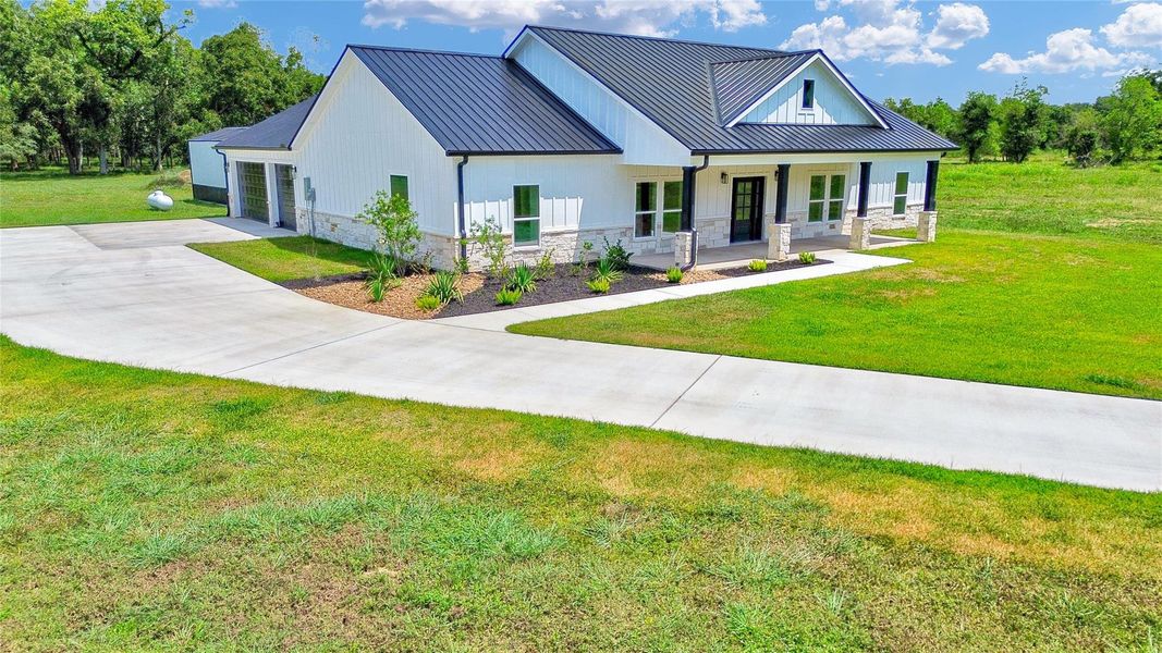 Front exterior of a new home in , Angleton, TX, highlighting curb appeal (Image 24).