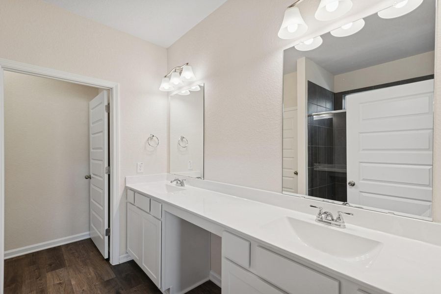 The Crawford- Primary Bath with Dual Vanities. Sample image for illustration; upgrades, options, and colors may vary. The Crawford- Primary Bath with Dual Vanities. Sample image for illustration; upgrades, options, and colors may vary.