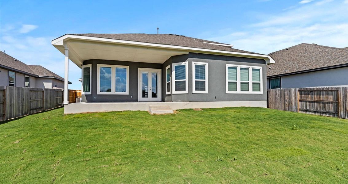 Exterior details and patio area of a home in Village at Three Oaks, Seguin (Image 4).