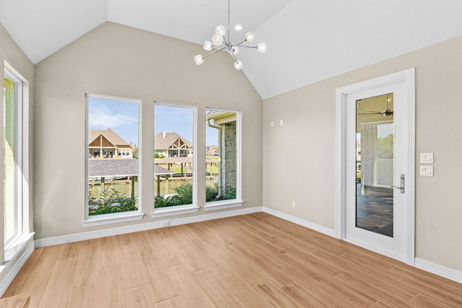 Bright and inviting casual dining space with backyard views and access to the patio.