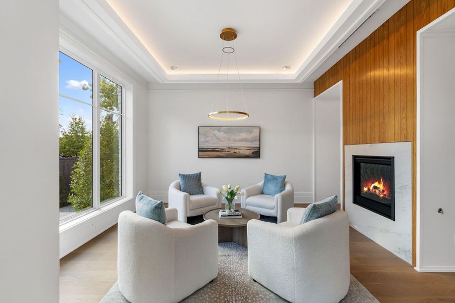 Formal living or optional study with double sided gas fireplace.
