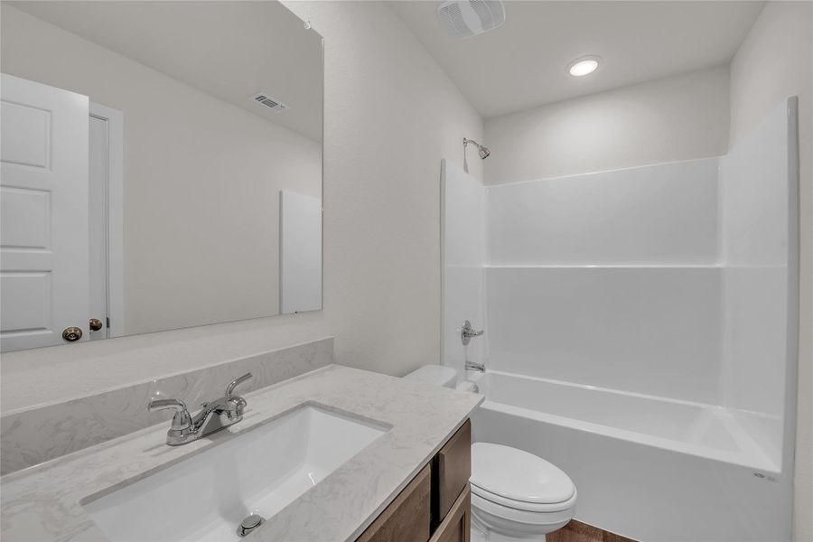 Bathroom featuring shower / bath combination and vanity Bathroom featuring shower / bath combination and vanity