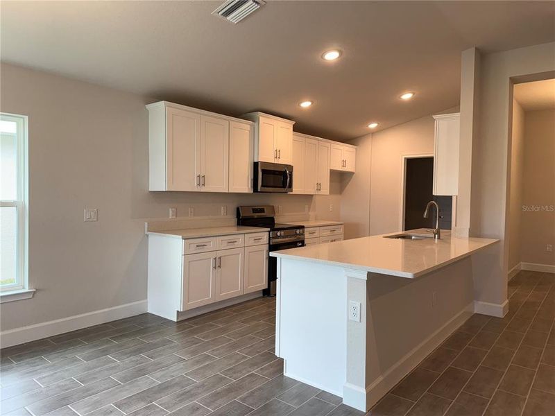 Furnished interior view inside a new home in Watercress Cove, North Port (Image 5).