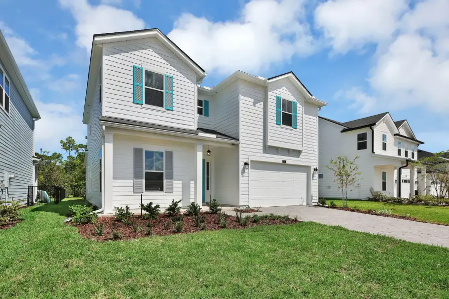 Representative exterior photo of a completed home built from the Crescent by Riverside Homes in Sagebrush at EverRange, Jacksonville, FL (Image 24).