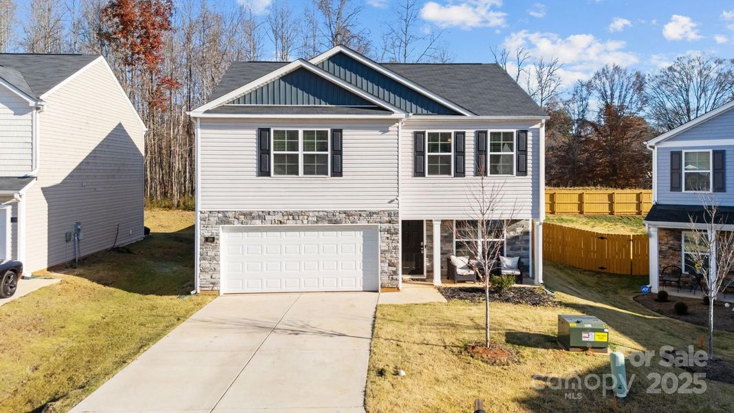 Front exterior of a new home in , Mocksville, NC, highlighting curb appeal (Image 2).