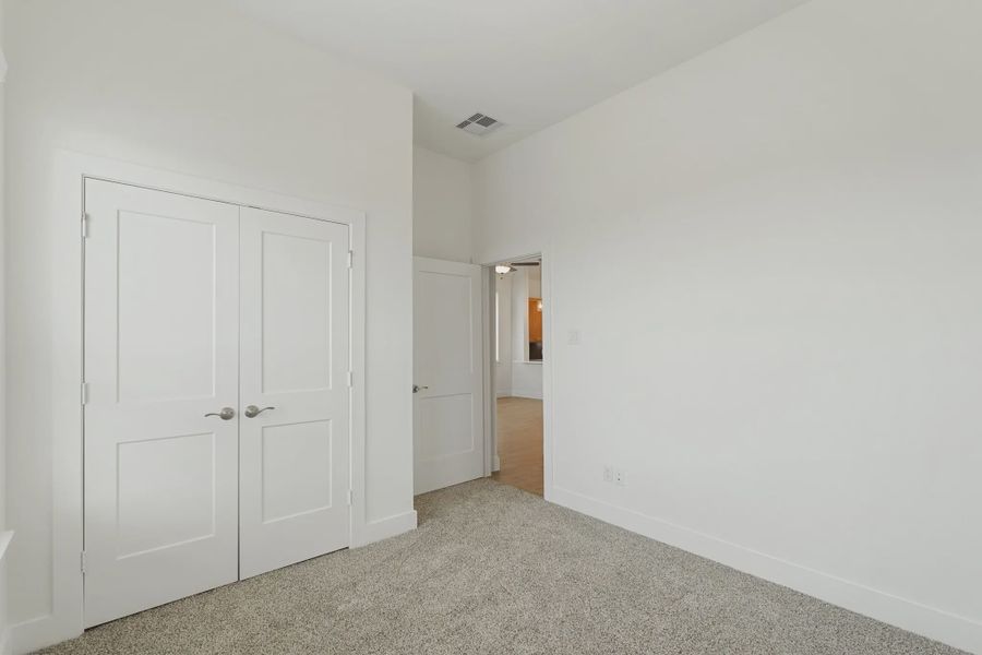 Representative unfurnished interior of a home built from the Torrey Pines by Chesmar Homes in Riceland Alley Loads, Mont Belvieu (Image 11).
