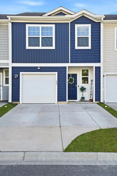 Front exterior of a new home in , Summerville, SC, highlighting curb appeal (Image 1). Front exterior of a new home in , Summerville, SC, highlighting curb appeal (Image 1).