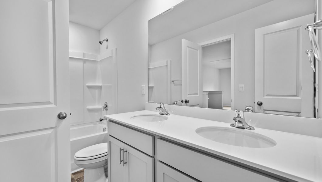 Representative furnished interior of a home built from the Biltmore by D.R. Horton in Woodglen, Piedmont (Image 9).