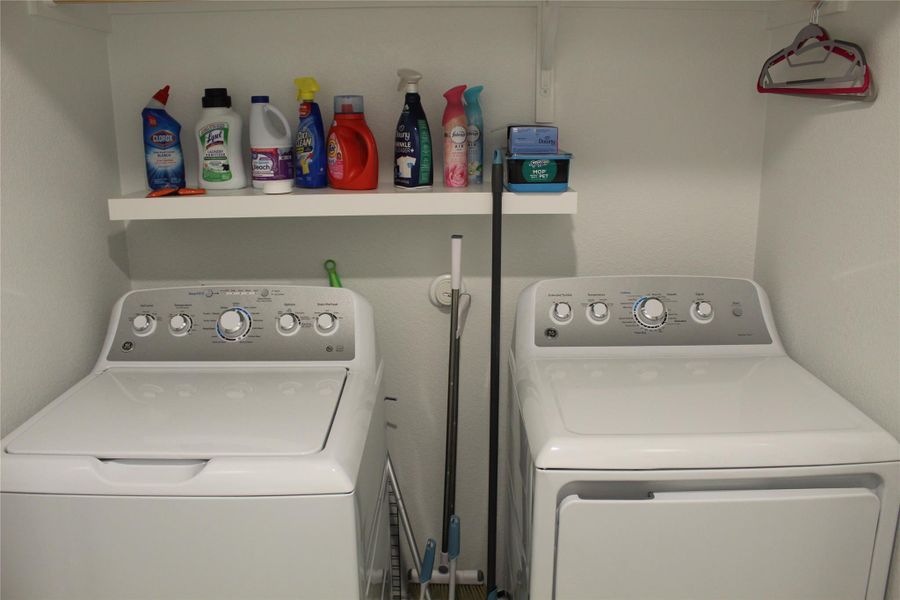 Laundry room with separate washer and dryer which will convey