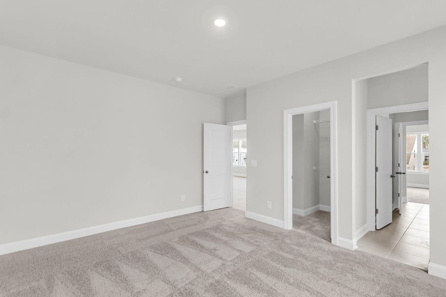 Spacious, unfurnished interior of a new home in Tidewater at Lakes of Cane Bay, Summerville (Image 52).