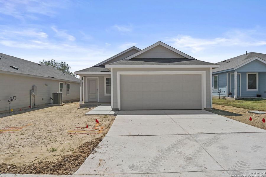 Front exterior of a new home in Waterwheel: Cottage Collection, San Antonio, TX, highlighting curb appeal (Image 1). Front exterior of a new home in Waterwheel: Cottage Collection, San Antonio, TX, highlighting curb appeal (Image 1).