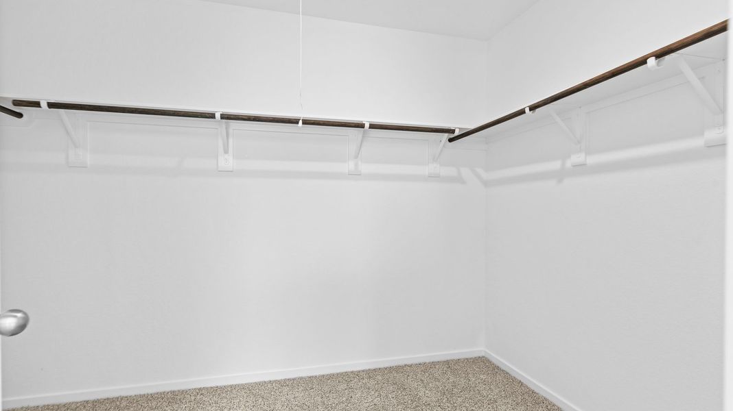 Spacious, unfurnished interior of a new home in Caldwell Crossing, Iowa Colony (Image 12).