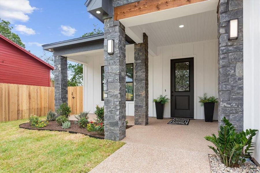 Property entrance featuring stone, siding and covered porch Property entrance featuring stone, siding and covered porch