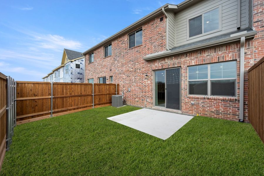 Exterior details and patio area of a home in Wildridge, Oak Point (Image 3).