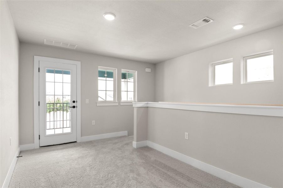 Empty room with healthy amount of natural light, carpet flooring, baseboards, and recessed lighting Empty room with healthy amount of natural light, carpet flooring, baseboards, and recessed lighting