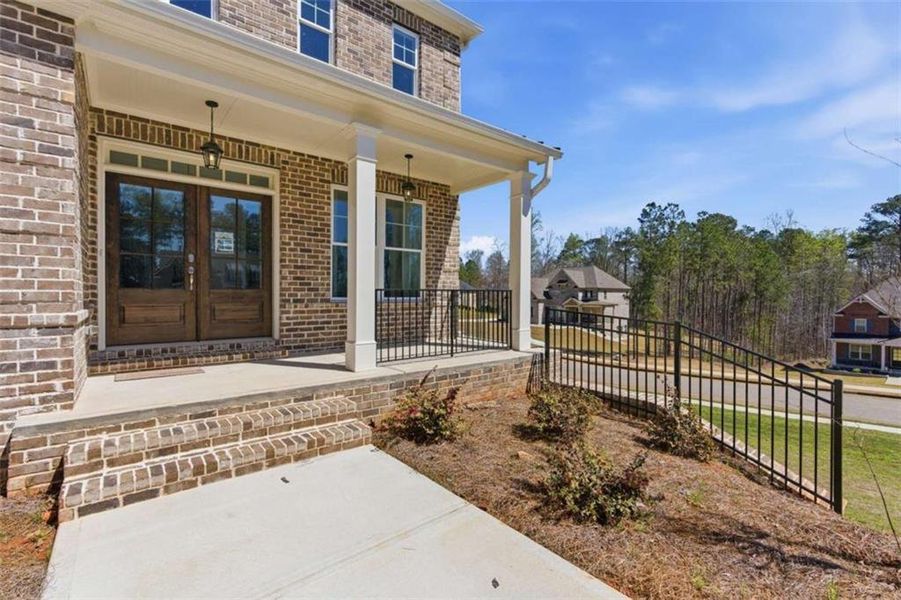 Exterior details and patio area of a home in The Estates at Hurricane Pointe, Douglasville (Image 3). Exterior details and patio area of a home in The Estates at Hurricane Pointe, Douglasville (Image 3).