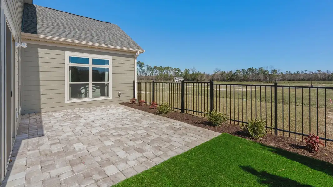 Exterior details and patio area of a home in Courtyards by Carrell, Ocean Isle Beach (Image 2). Exterior details and patio area of a home in Courtyards by Carrell, Ocean Isle Beach (Image 2).