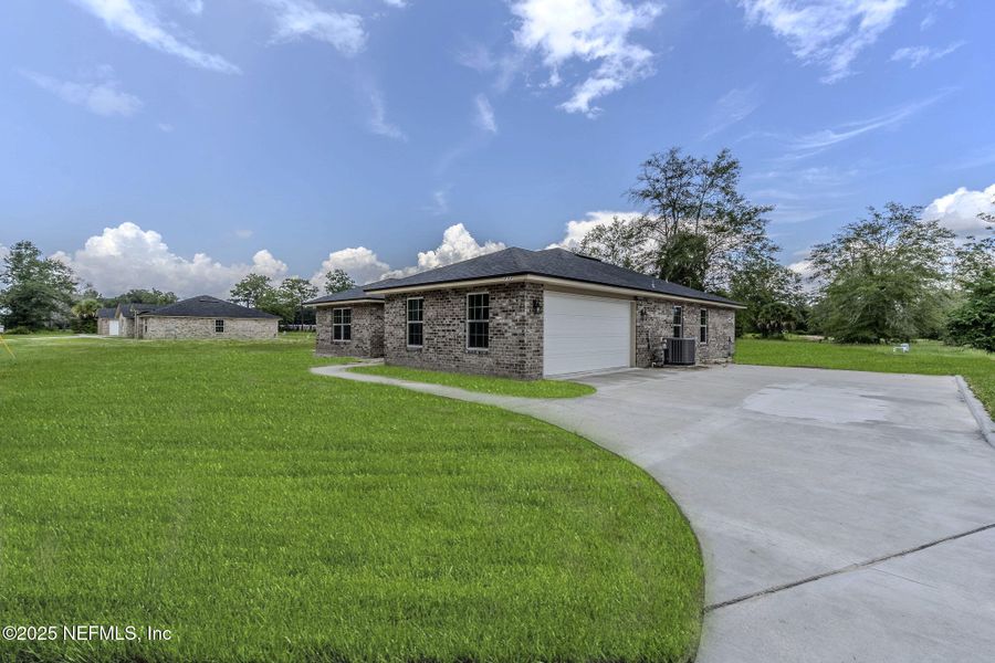 Front exterior of a new home in , Callahan, FL, highlighting curb appeal (Image 2).