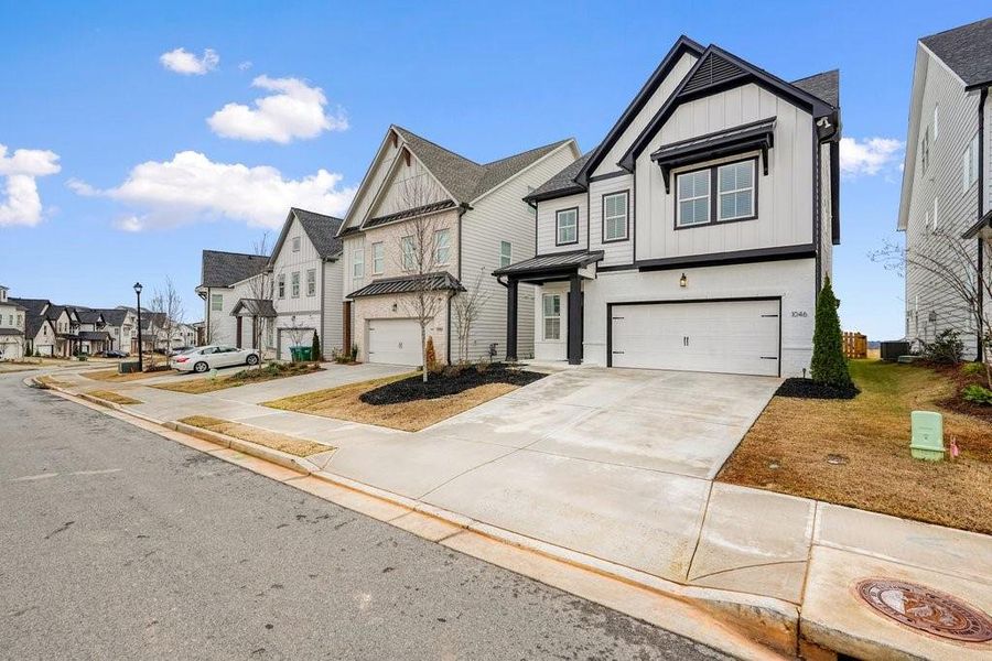 Front exterior of a new home in , Canton, GA, highlighting curb appeal (Image 25). Front exterior of a new home in , Canton, GA, highlighting curb appeal (Image 25).