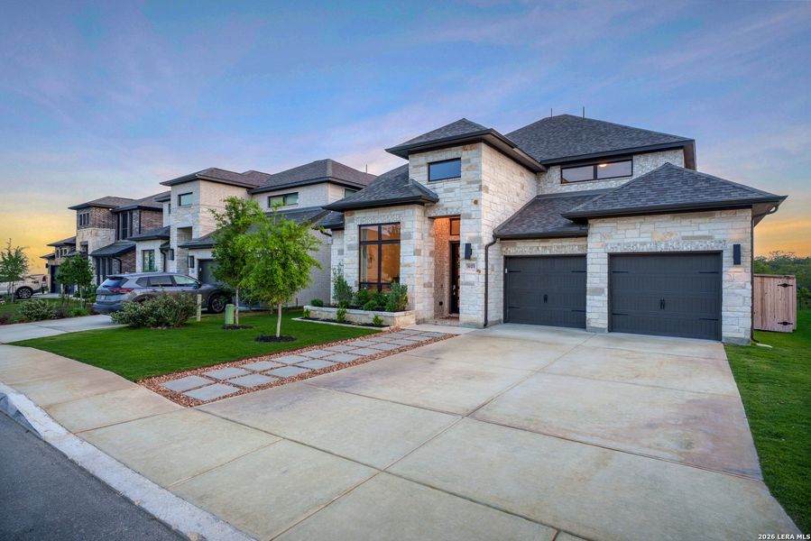 Front exterior of a new home in Ladera, San Antonio, TX, highlighting curb appeal (Image 28). Front exterior of a new home in Ladera, San Antonio, TX, highlighting curb appeal (Image 28).