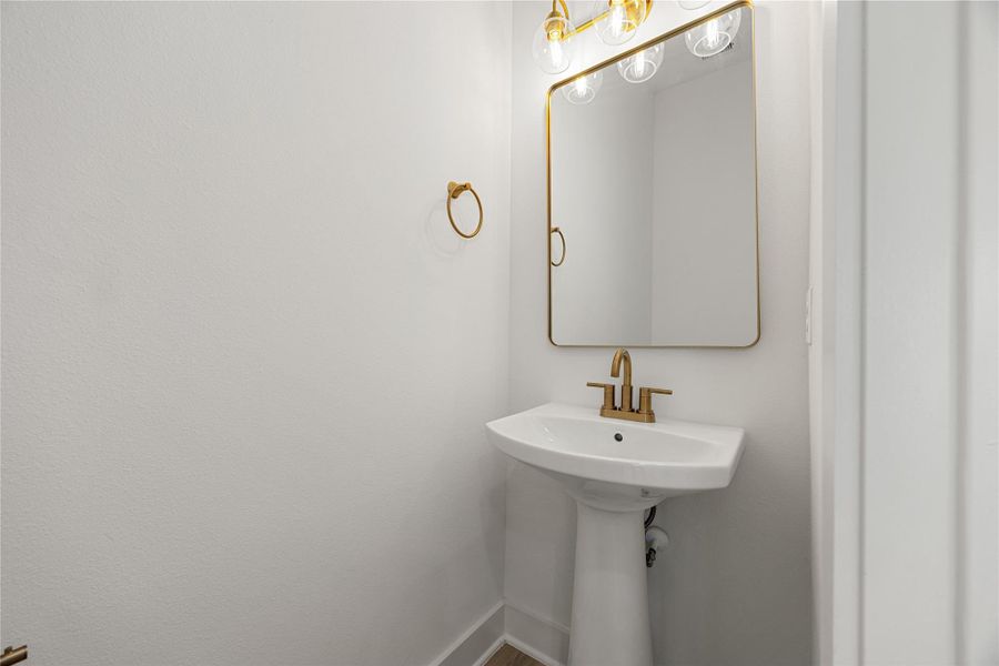 This half bath is conveniently located on the first floor for all your guests to use. This half bath is conveniently located on the first floor for all your guests to use.