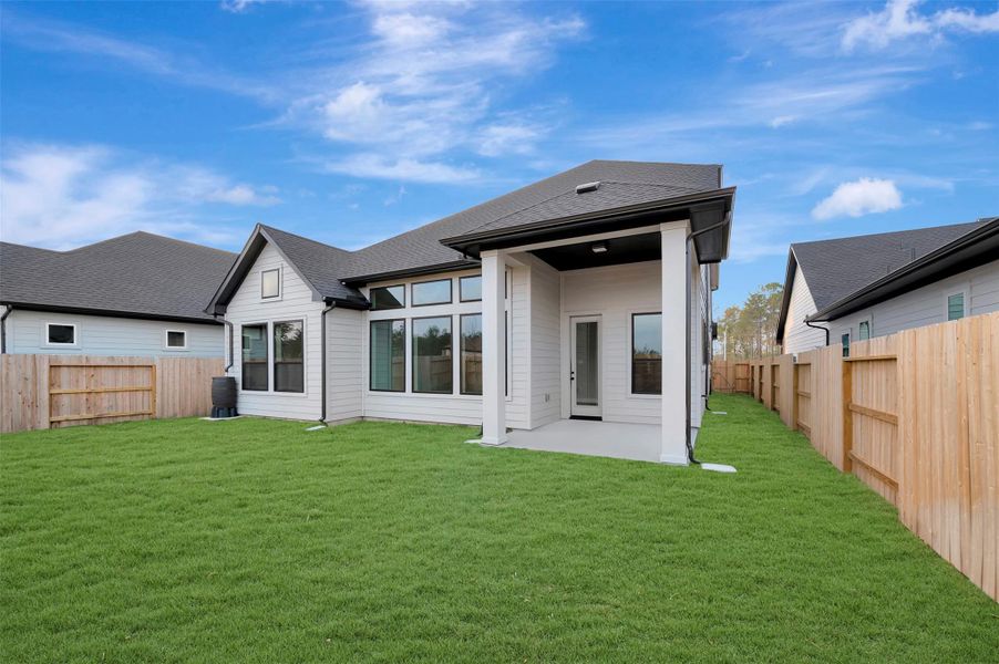 Exterior details and patio area of a home in ARTAVIA 50' Homesites, Conroe (Image 3).