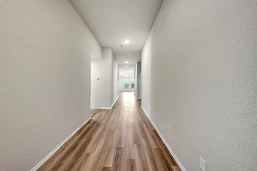 Spacious, unfurnished interior of a new home in Carillon, Manor (Image 29).