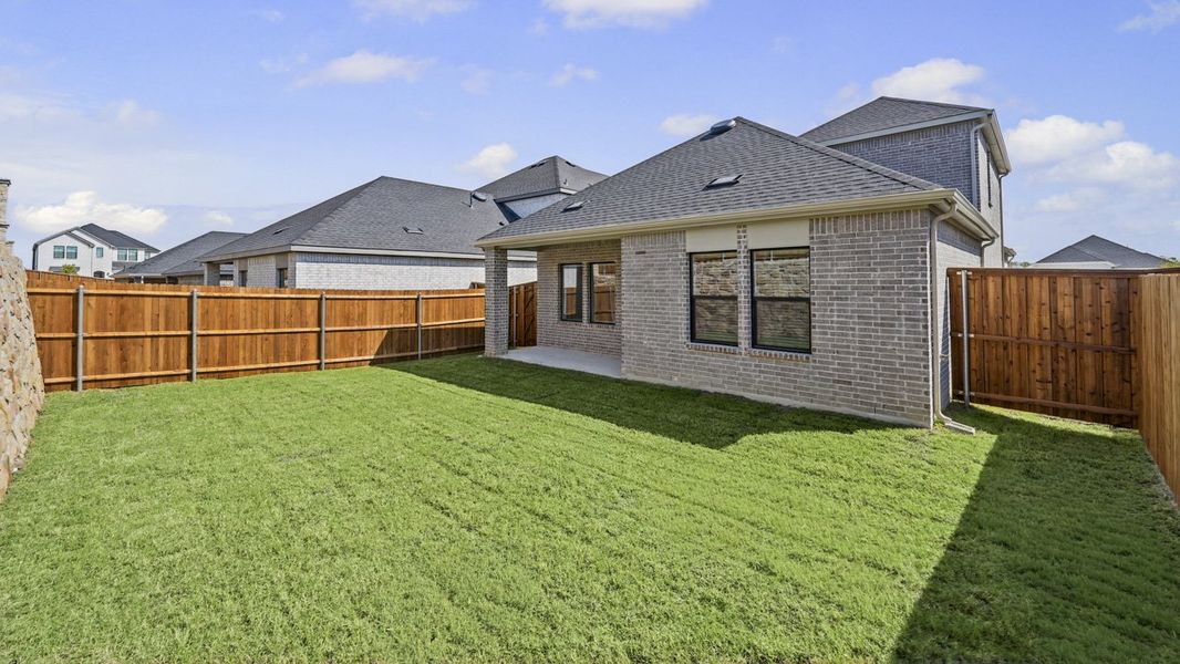 Exterior details and patio area of a home in Windchime, Celina (Image 4).